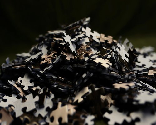 Angled smartphone showing the fictional Coral Grid Crafter puzzle game