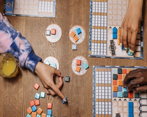 Players designing a colourful pixel world in the fictional BONUS World Workshop game